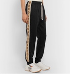 Gucci - Tapered Logo-Jacquard Webbing-Trimmed Tech-Jersey Track Pants - Black