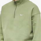 Nike Men's Solo Swoosh Quarter-Zip in Oil Green/White