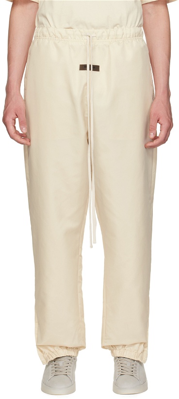 Photo: Fear of God ESSENTIALS Off-White Drawstring Track Pants