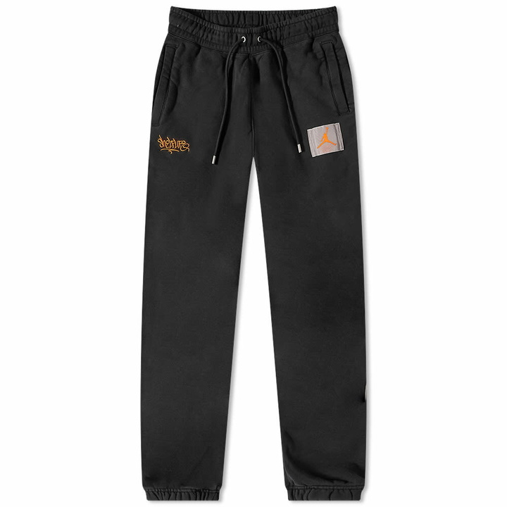 Photo: Air Jordan Women's x Shelf Life Pant in Black/Total Orange