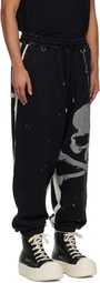 MASTERMIND WORLD Black Cut-Off Sweatpants