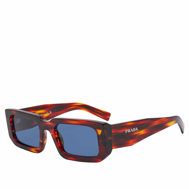 Photo: Prada Eyewear Men's 06YS Sunglasses in Striped Radica/Dark Blue 