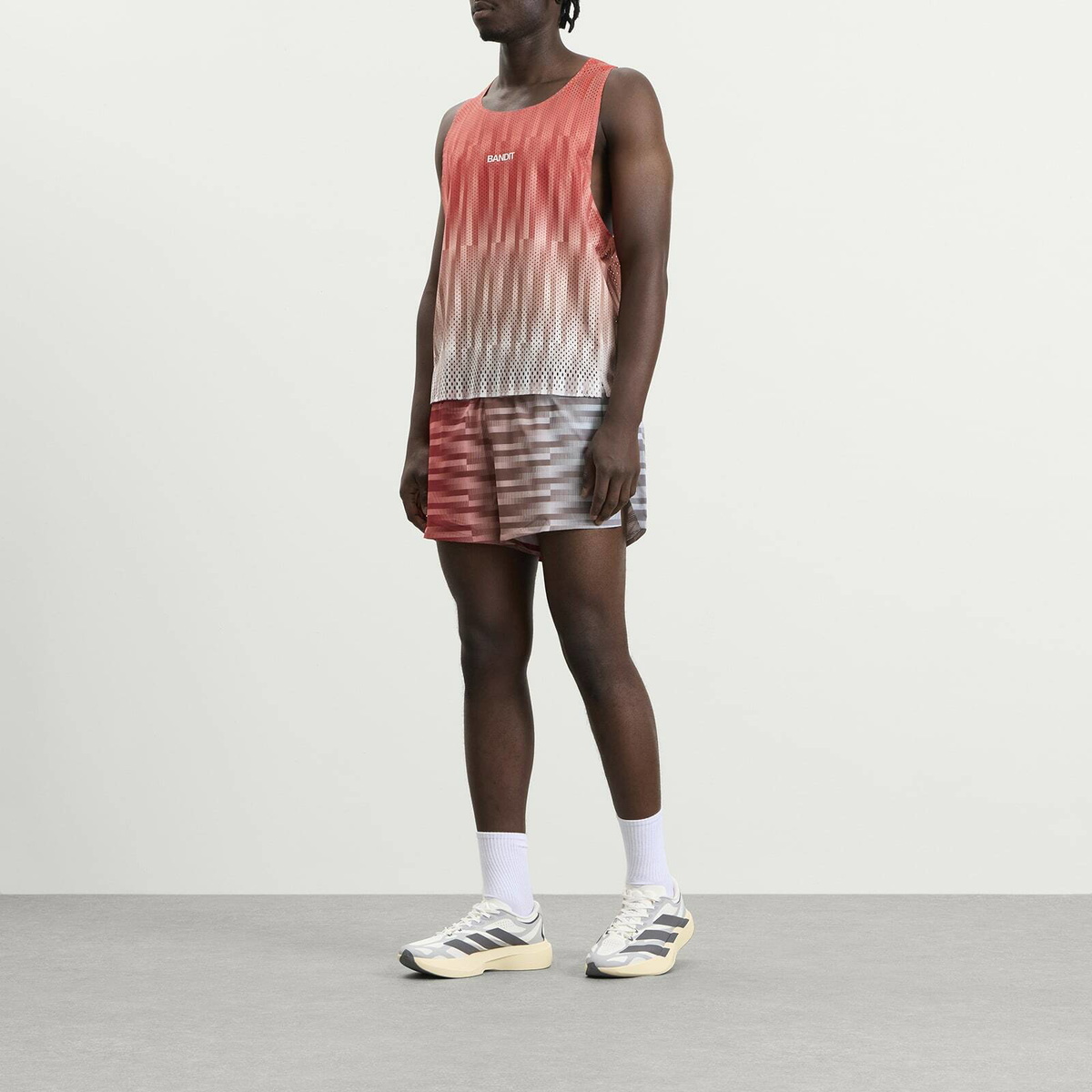 Bandit Men's Open Mesh Gradient Cut Race Singlet in Poppy Multi/Uneven Vertical Gradient