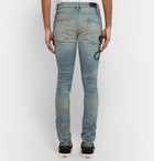 AMIRI - Thrasher Skinny-Fit Appliquéd Distressed Stretch-Denim Jeans - Men - Light denim