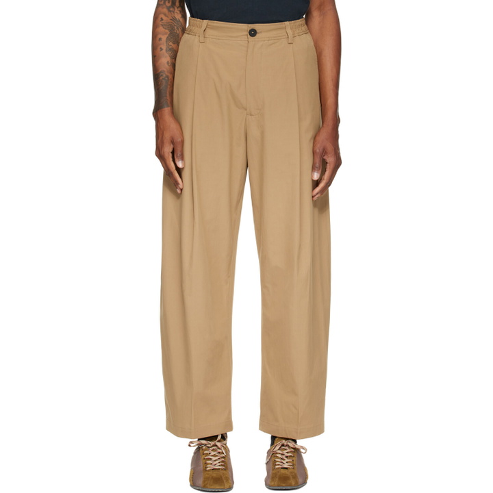 Photo: Studio Nicholson Tan Shire Cotton Pleated Trousers