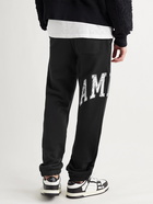 AMIRI - Slim-Fit Tapered Logo-Appliquéd Loopback Cotton-Jersey Sweatpants - Black