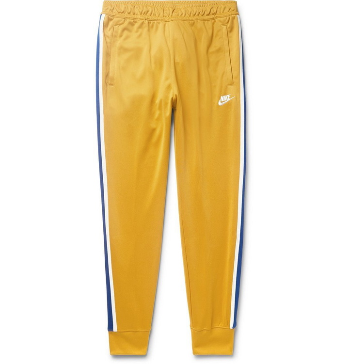 Photo: Nike - Sportswear Tapered Webbing-Trimmed Tech-Jersey Track Pants - Men - Saffron