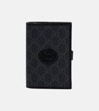 Gucci - GG embossed passport holder