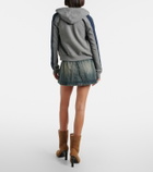 Balenciaga Distressed denim miniskirt