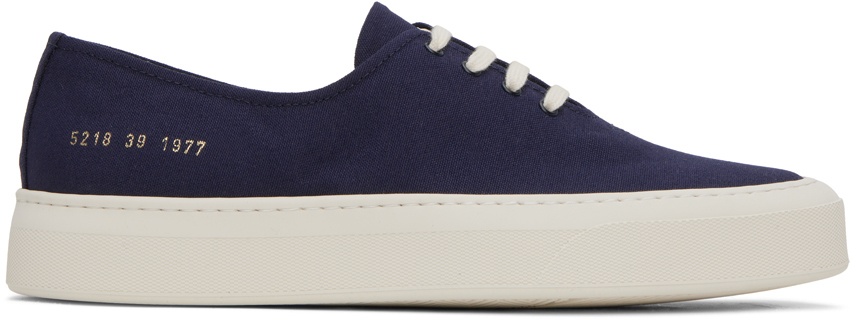 Photo: Common Projects Blue Four Hole Sneakers