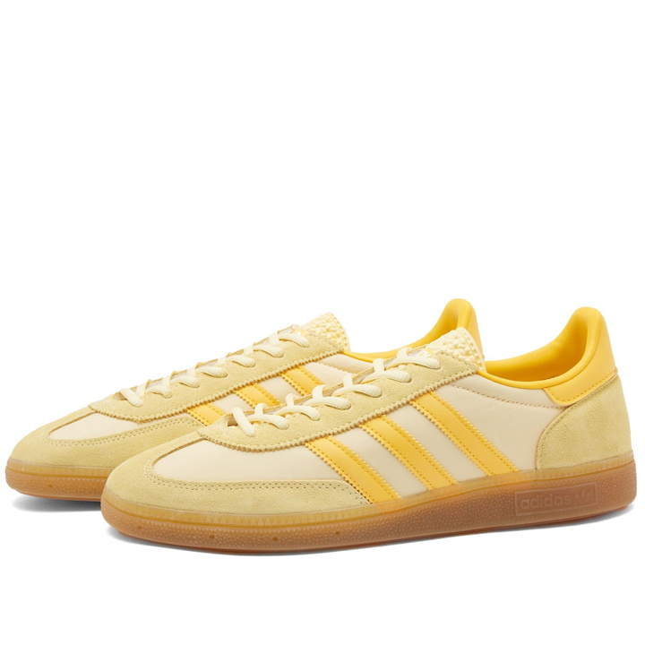 Photo: Adidas Men's Handball Spezial Sneakers in Almost Yellow/Bold Gold