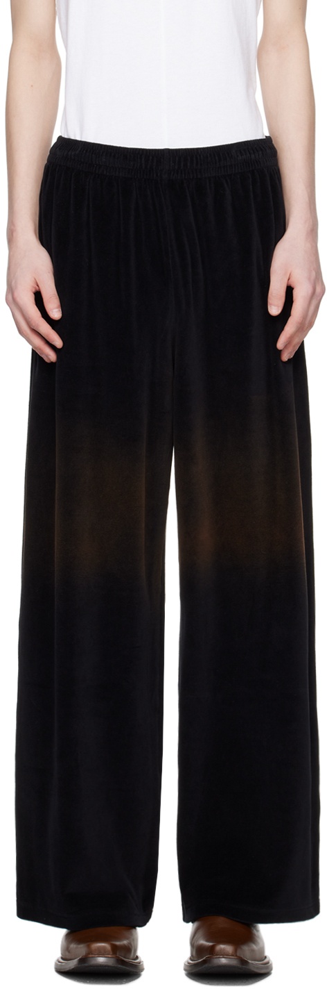 Photo: Acne Studios Black Embossed Trousers