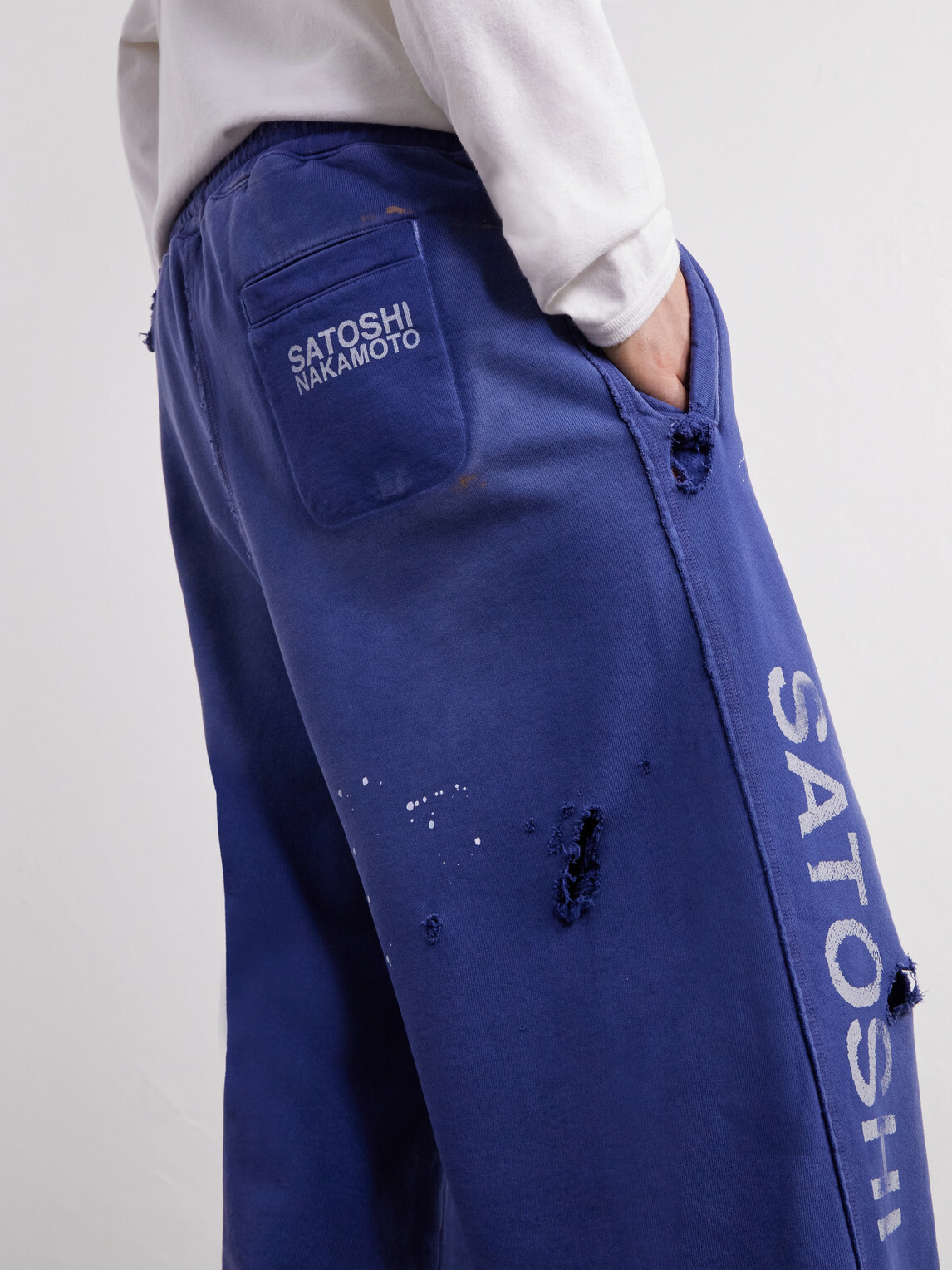 Satoshi Nakamoto - Luke Logo-Printed Paint-Splattered Distressed Cotton-Jersey Drawstring Sweatpants - Blue