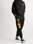 Y,IWO - Tapered Logo-Print Cotton-Jersey Sweatpants - Black