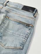 AMIRI - Skinny-Fit Logo-Appliquéd Distressed Jeans - Blue