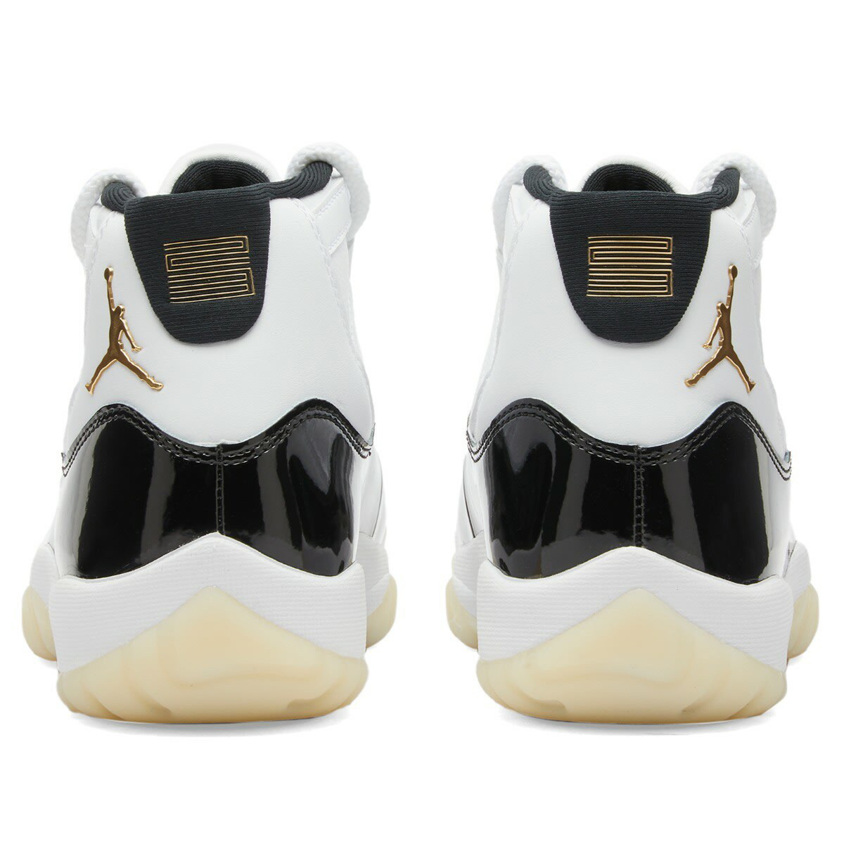 Air Jordan 11 Retro Sneakers in White/Metallic Gold/Black Nike