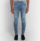 AMIRI - MX1 Skinny-Fit Panelled Distressed Stretch-Denim Jeans - Men - Mid denim
