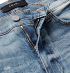 AMIRI - Skinny-Fit Distressed Paint-Splattered Stretch-Denim Jeans - Light blue