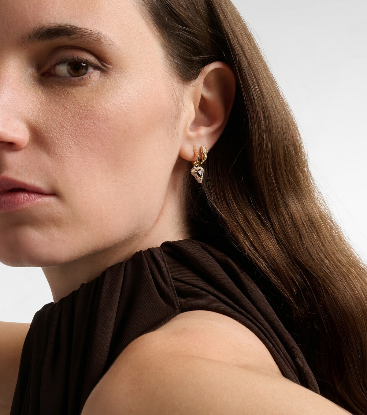Stone and Strand Power 14kt gold huggie earrings with diamonds and garnet
