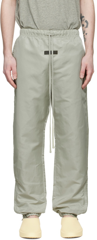 Photo: Fear of God ESSENTIALS Green Nylon Track Pants