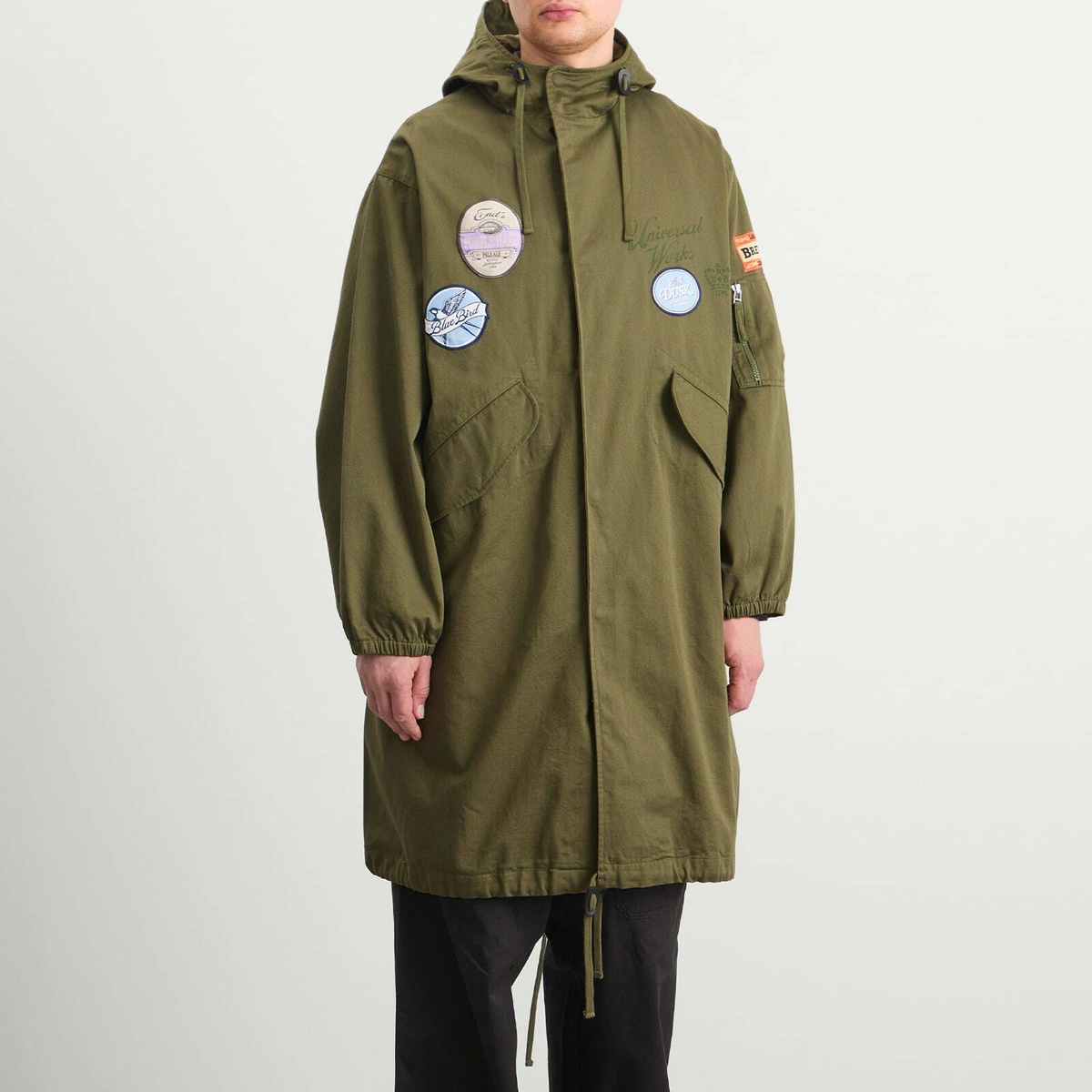 END. x Universal Works Men's Shipp Inn Parka Jacket in Light Olive