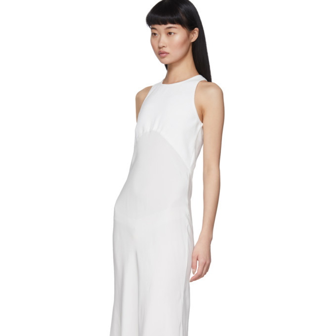 Gown : White tapeta silk gown with heavy thread work dupatta