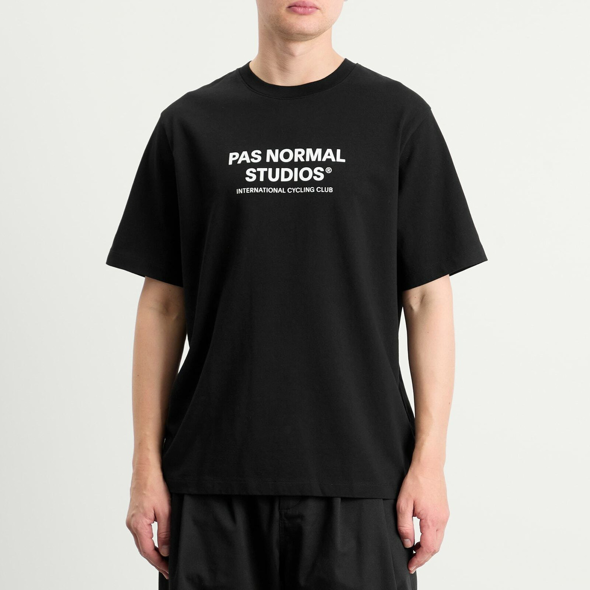 Pas Normal Studios Men's Off-Race Logo T-Shirt in Black