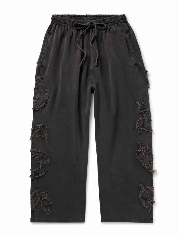 Photo: Acne Studios - Prowser Wide-Leg Distressed Appliquéd Cotton-Jersey Sweatpants - Black