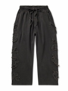 Acne Studios - Prowser Wide-Leg Distressed Appliquéd Cotton-Jersey Sweatpants - Black