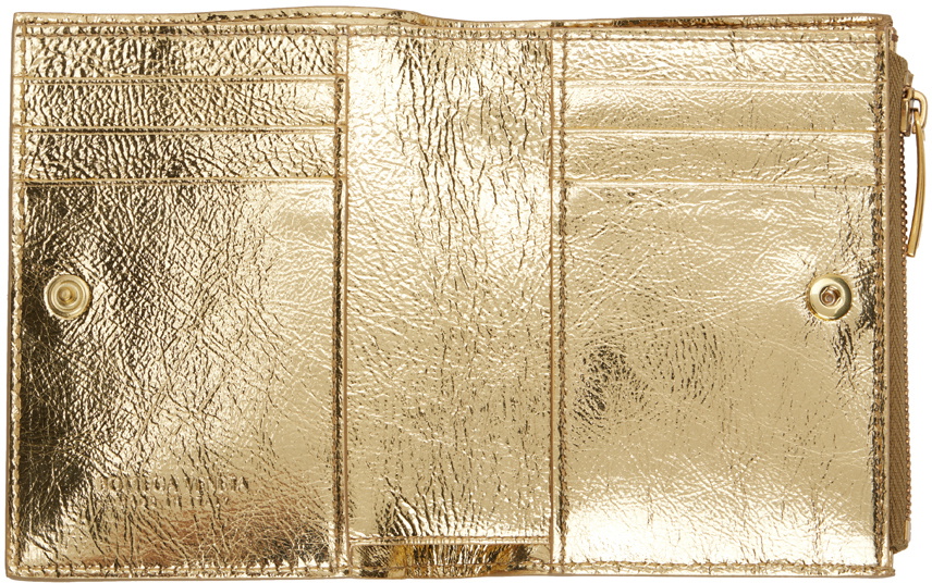 Bottega Veneta selling zip wallet gold