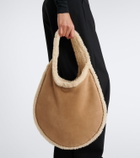 Alaïa One Piece shearling-lined suede shoulder bag