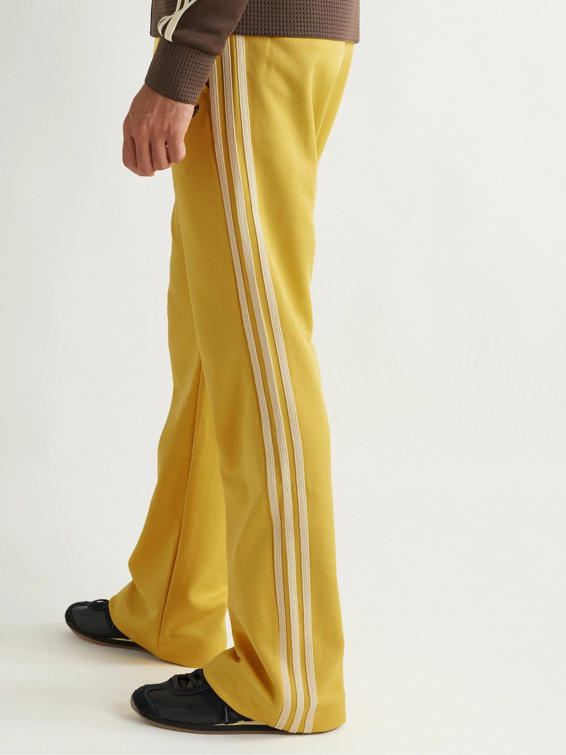 Adidas pants with hot sale yellow stripes