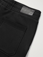 AMIRI - Slim-Fit Tapered Logo-Appliquéd Loopback Cotton-Jersey Sweatpants - Black