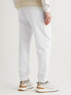 Brunello Cucinelli - Tapered Pleated Cotton-Jersey Sweatpants - Neutrals