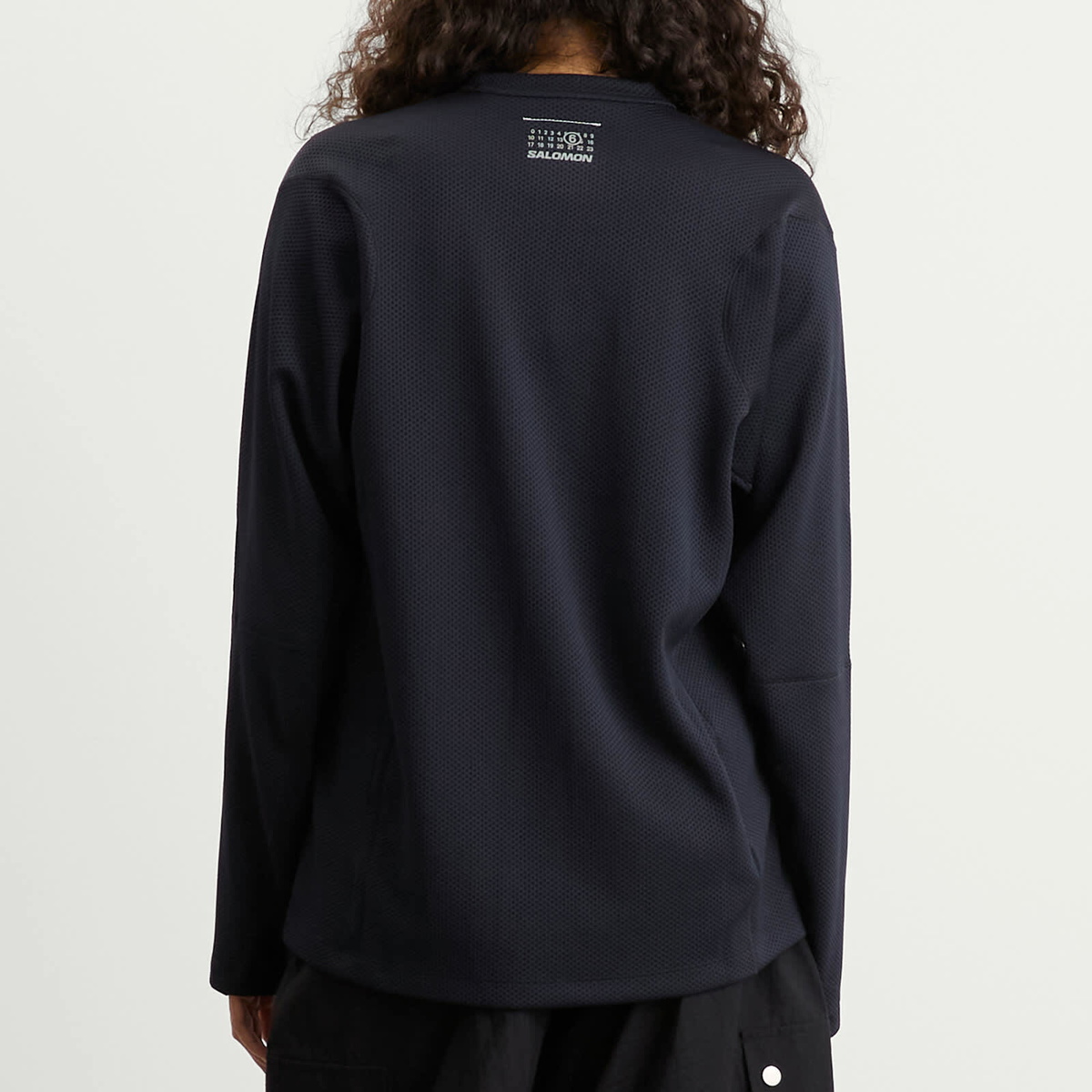 MM6 Maison Margiela Women's x Salomon Perforated Long Sleeve Sweater in Washed Black