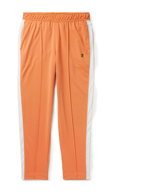 Photo: Nike Tennis - Court Heritage Tapered Striped Tech-Jersey Tennis Trousers - Orange