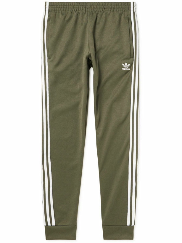 Photo: adidas Originals - Tapered Logo-Embroidered Striped Recycled Jersey Sweatpants - Green
