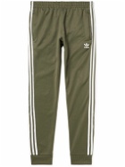adidas Originals - Tapered Logo-Embroidered Striped Recycled Jersey Sweatpants - Green