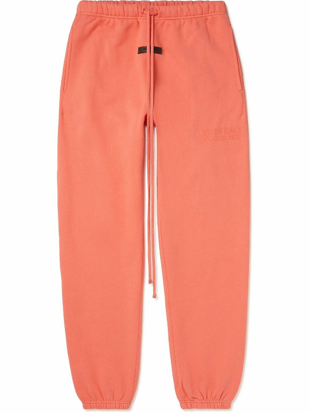 Photo: FEAR OF GOD ESSENTIALS - Tapered Logo-Appliquéd Cotton-Blend Jersey Sweatpants - Orange