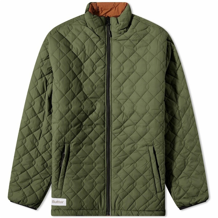 Photo: Butter Goods Men's Chain Link Reversible Puffer Jacket in Army/Orange