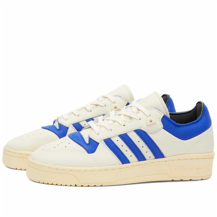Photo: Adidas Men's RIVALRY 86 LOW 002 Sneakers in Cream White/Lucid Blue/Easy Yellow