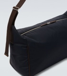 The Row Logan E/W leather-trimmed crossbody bag