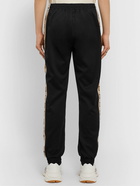 GUCCI - Tapered Logo-Jacquard Webbing-Trimmed Tech-Jersey Track Pants - Black