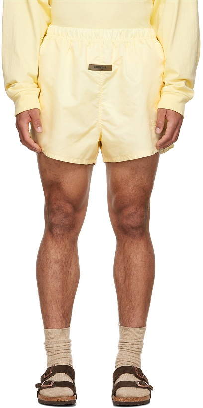 Photo: Fear of God ESSENTIALS Yellow Nylon Shorts