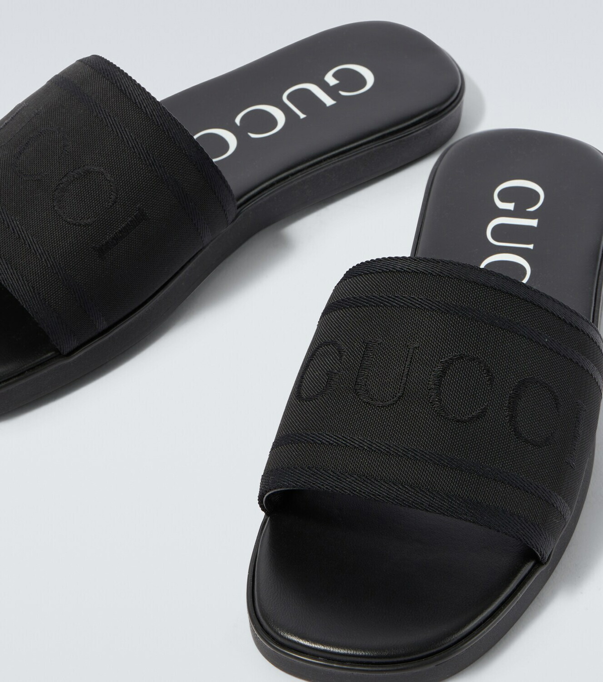 Gucci Logo canvas and leather slides