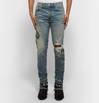 AMIRI - Skinny-Fit Appliquéd Distressed Stretch-Denim Jeans - Men - Light denim