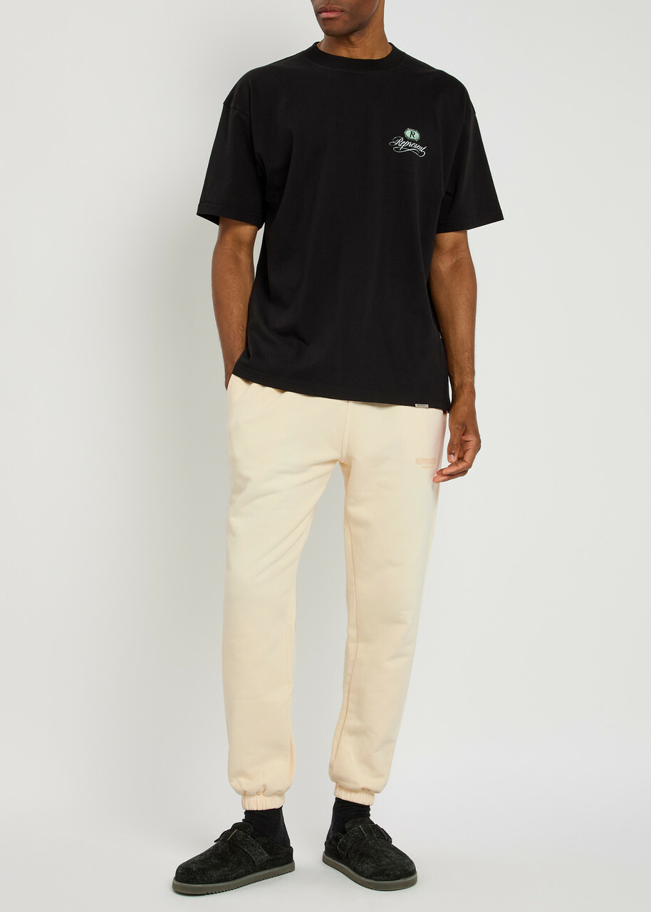 Represent Owners Club Logo-print Cotton Sweatpants Cream