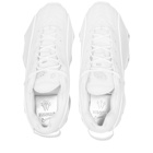 Nike NOCTA Glide Sneakers in White/Chrome/Gold