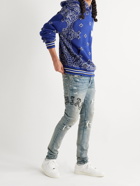 AMIRI - Skinny-Fit Appliquéd Panelled Distressed Jeans - Blue