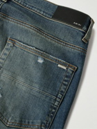 AMIRI - MX1 Skinny-Fit Panelled Distressed Jeans - Blue